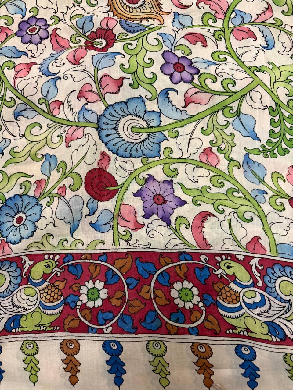 Close-up of hand pen Kalamkari dupatta body and border – intricate blue, pink and purple floral vine on ivory ground with peacock-pair motif on maroon border, tassels below, Mangalgiri silk