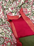 Hand pen Kalamkari dupatta with red and forest green cotton silk 3-piece unstitched suit set – flat lay overview, ivory floral vine body with peacock border, House of Tantuvana