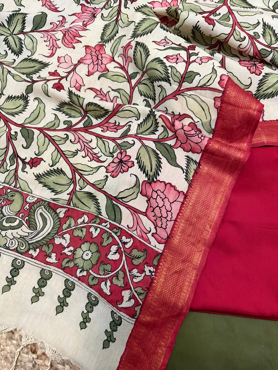 Close-up of hand pen Kalamkari dupatta border and body alongside red cotton silk kurta fabric – pink peony floral vine on ivory, peacock-pair on crimson border with gold Zari edge, Mangalgiri silk