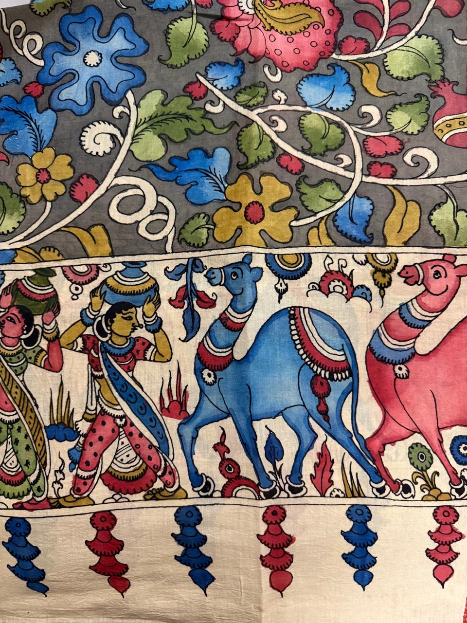 Detail of hand painted Kalamkari dupatta ivory mythological pallu – gopi figures with pots, blue camel and pink animal procession with red and blue tassel fringe below, grey floral body above