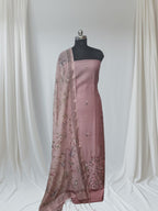 Dusky pink embroidered suit set – fabric texture and border detail
