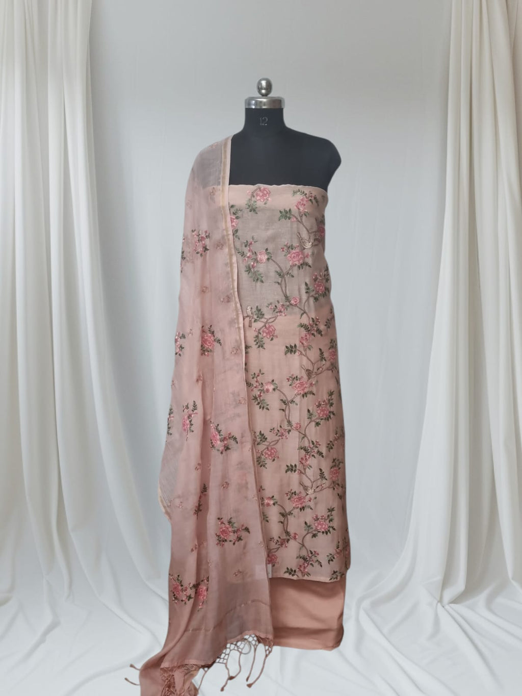 Peach embroidered suit set – fabric texture and border detail