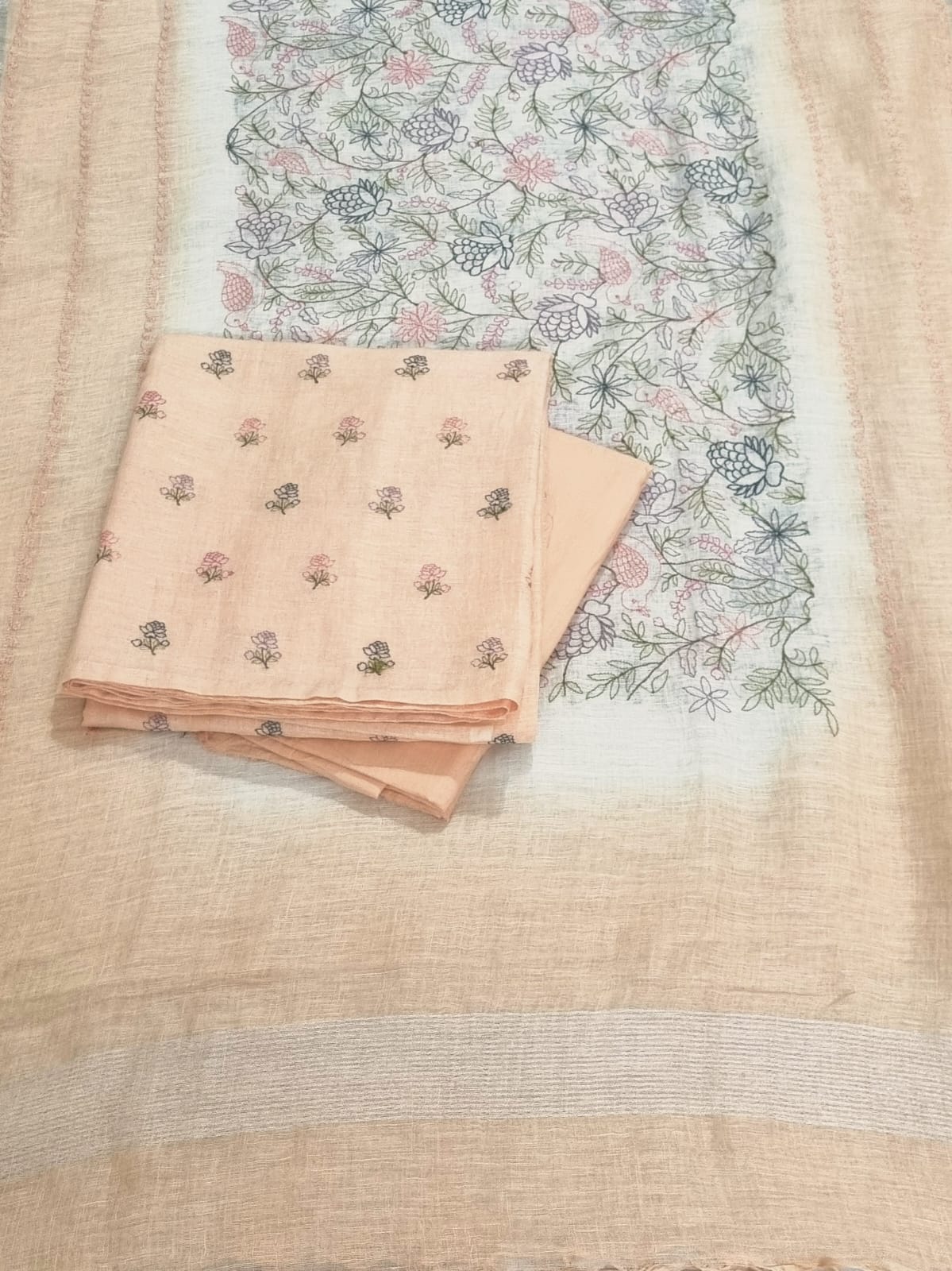 Light apricot linen unstitched suit set – front flat lay with embroidery detail