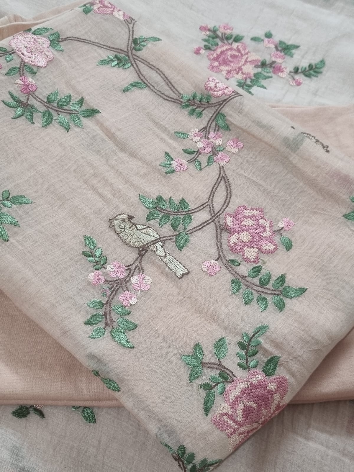 Machine embroidered Peach suit – close-up of embroidery detail
