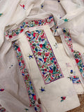 Cream cotton unstitched kurta with dense red and green Sindhi hand embroidery – geometric neckline panel, all-over butti motifs and embroidered dupatta, 3-piece suit set flatlay