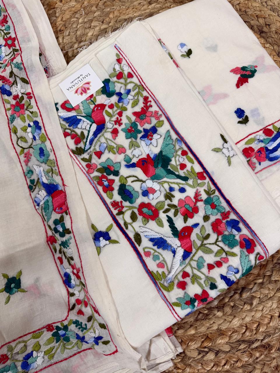 Close-up of cream cotton kurta neckline panel with Parsi Gara hand embroidery – red, blue and green bird and floral jaal motifs, with matching floral border dupatta