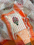 Overhead flatlay of white cotton Mughal block print unstitched kurta – orange zigzag chevron body with pink floral butti placement, orange paisley bottom fabric and sheer Kota Doria dupatta with orange chevron and border draped around