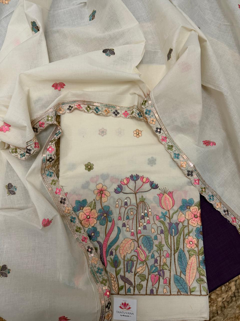 Cream Cotton 3-Piece Unstitched Suit Set Flat Lay – Multicolour Floral Garden Embroidery Kameez with Sequin Scallop Border & Purple Bottom