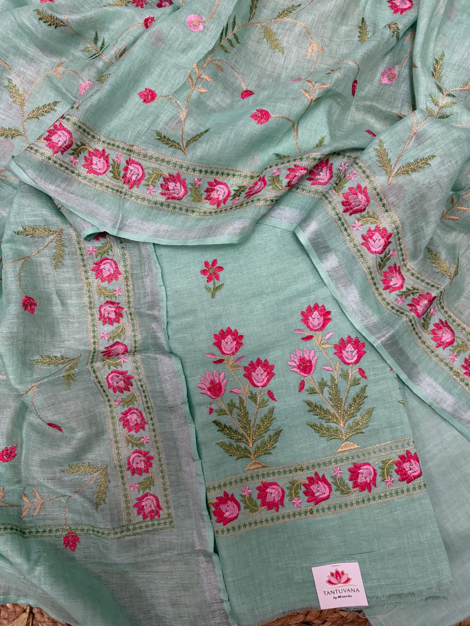 Aqua Green Linen Unstitched Suit Set Flat Lay – Multicolor Floral Machine Embroidery with Gold Border