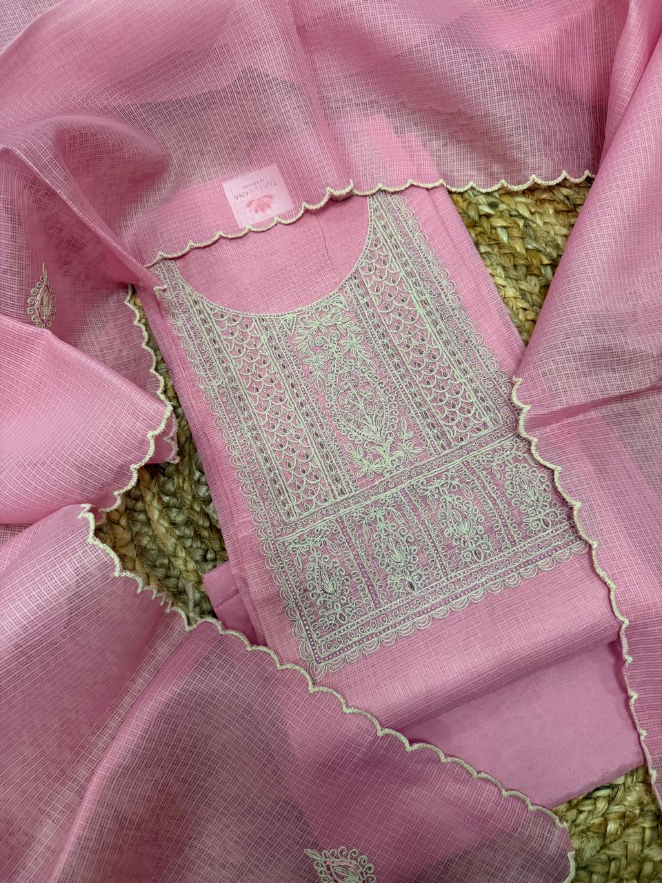 Powder pink Kota weave 3-piece unstitched suit set – overhead flat lay showing kurta with sage green dori embroidery panel, scallop edge dupatta
