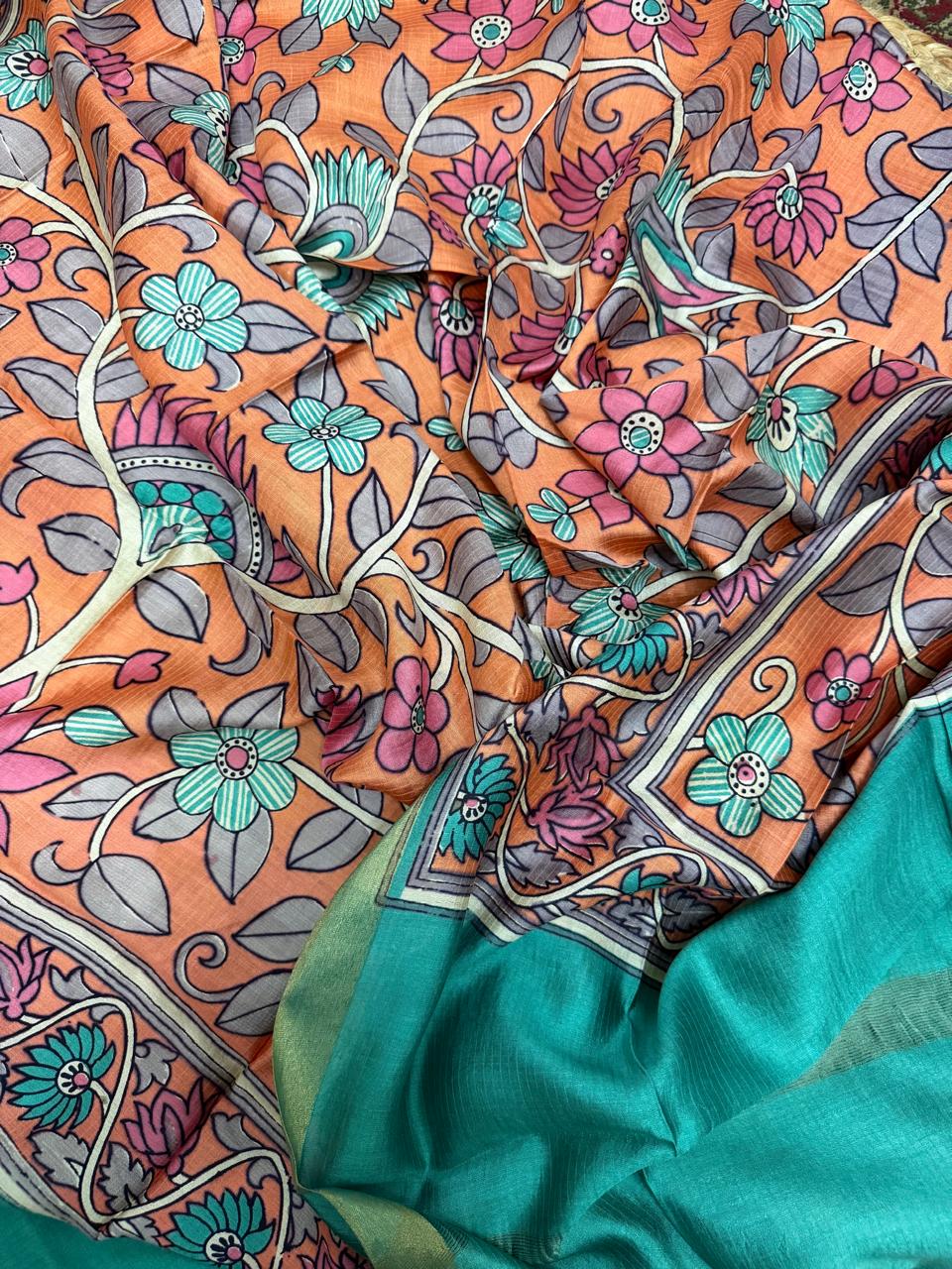 Orange Kalamkari Maheshwari silk dupatta – draped close-up showing all-over teal lotus and pink floral vine print with grey leaves, cream vine outline, and teal plain Maheshwari bottom with gold zari border