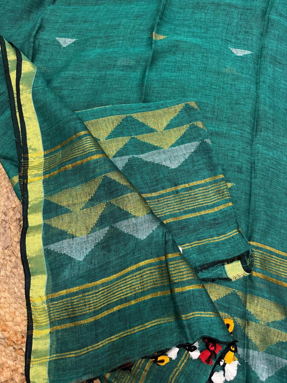 Teal green linen Jamdani unstitched suit material – close-up of silver and gold Zari inverted triangle weave, Indian handloom