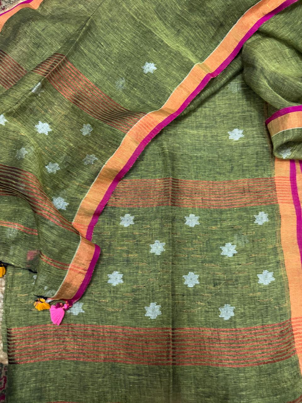 Mehandi green linen unstitched suit material – close-up of Jamdani woven metallic star Zari pattern, Indian handloom